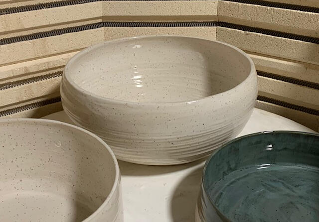 White Speckled Bowl in Kiln with Others